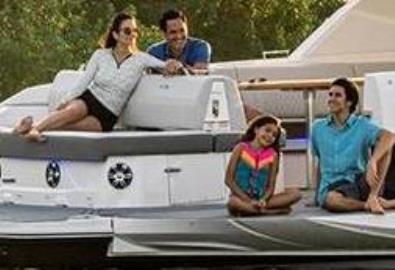 A family aboard an anchored boat