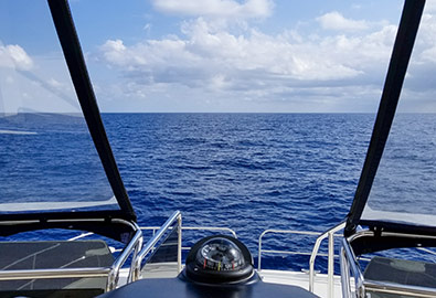 Power Catamaran on voyage to British Virgin Islands with compass in picture