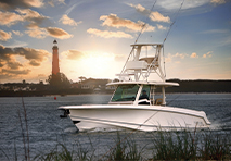 boston whaler with sunset in the background