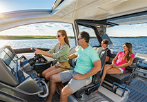 family of four driving a boat