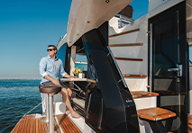 guy hanging out around a kitchen on the boat