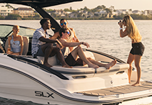 a group of people enjoying a boat ride on the water surrounded by a scenic view