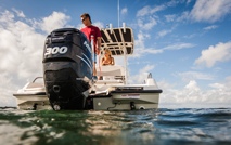 man standing on boat in the ocean