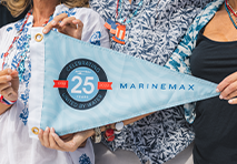 marinemax burgee being held by group of people