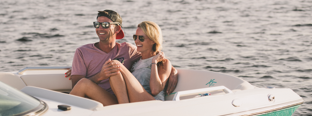Man and women sitting at bow of boat