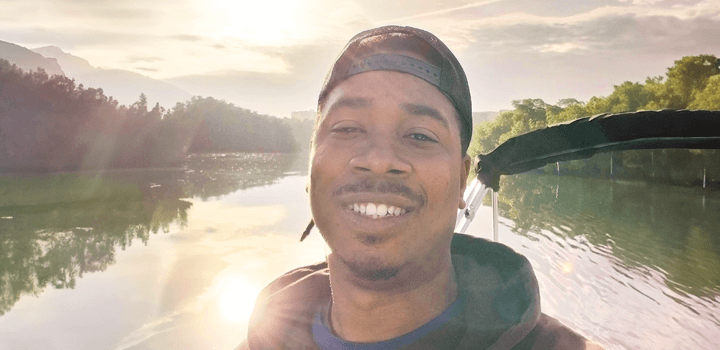 head shot of ismail on the water