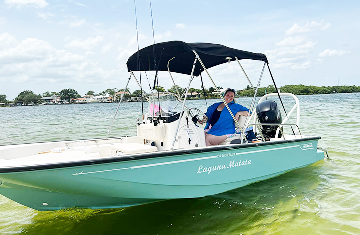 tina ernde on her teal boston whaler