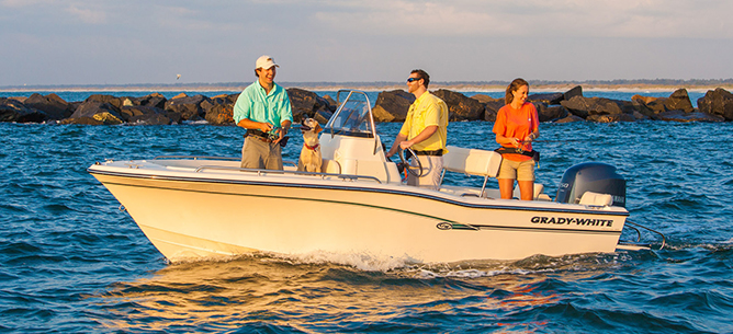 Three boaters fishing off a white Grady White boat