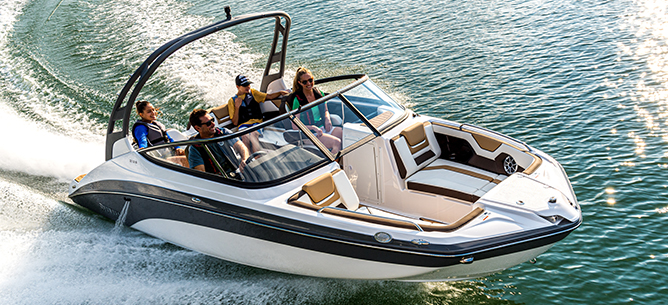 A black and white Yamaha Jet boat with a family aboard