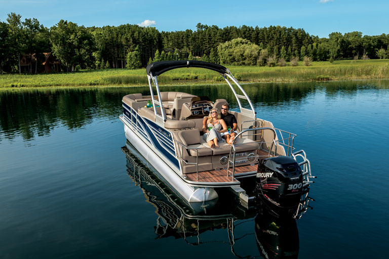 Couple relaxing on the back of a Pontoons Boat