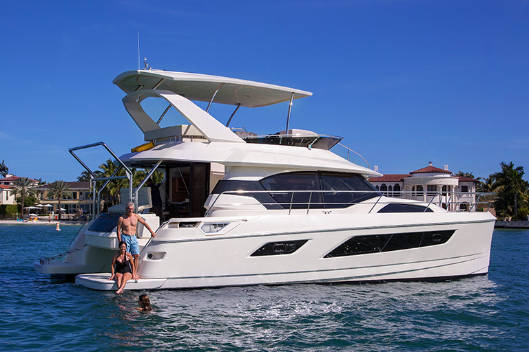 Friends diving from a Power Catamaran