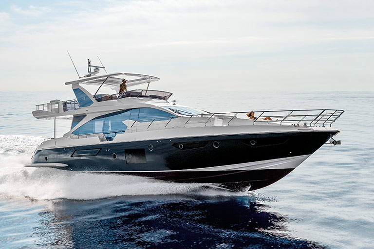 Beautiful blue and white Yacht cruising through blue waters.