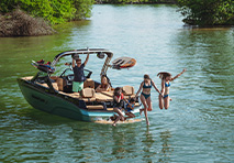 friends jumping off a mastercraft