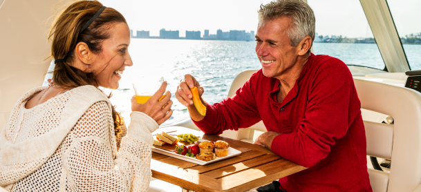 Couple enjoying their meal on a boat