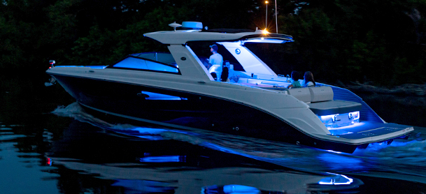 Boat with LED lights lit at night