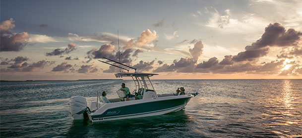 Boston Whaler 230 Outrage in still water with sunset