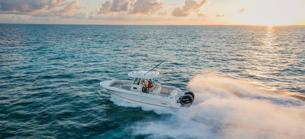 Boston Whaler 280 Outrage in the water with sunset