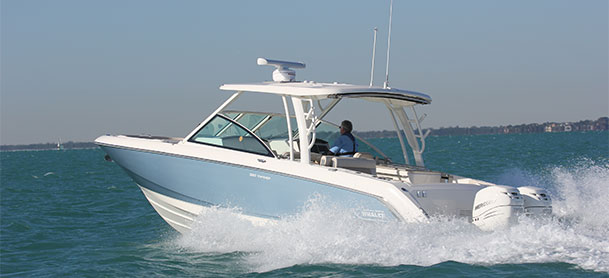 Blue Boston Whaler 320 Vantage in the water