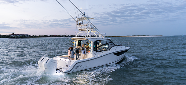 a family fishing aboard a 365 conquest