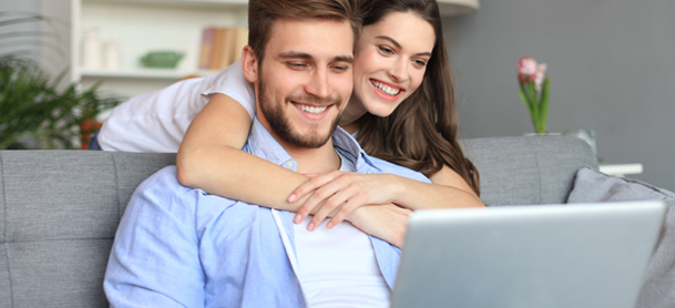 couple looking at the laptop