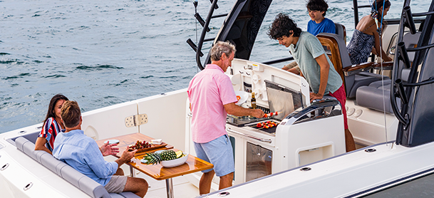 adults enjoying a meal on a boat