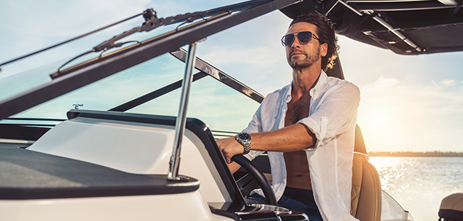 guy driving a boat