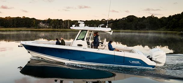 A blue and white Boston Whaler Outrage on the water