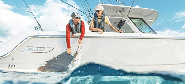 two fishers on a boston whaler with their catch