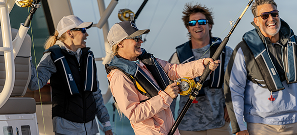 fishers reeling in a catch