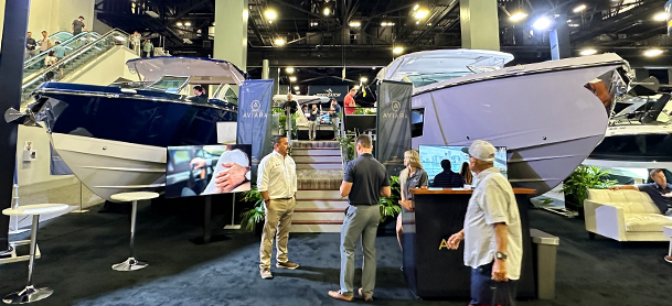 people touring a boat at a boat show