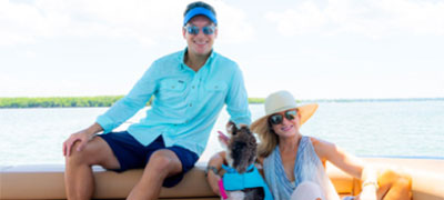 Two people sitting on Aviara boat