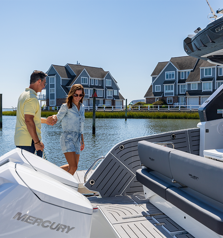 two people walking onto a Galeon Yacht