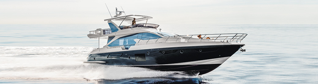 An Azimut 72 Flybridge cruising through open blue water from left to right