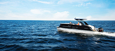 harris pontoon running over dark choppy open waters