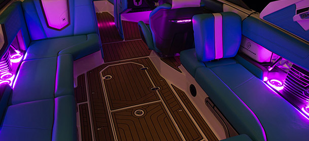 purple lights glowing on inside of boat