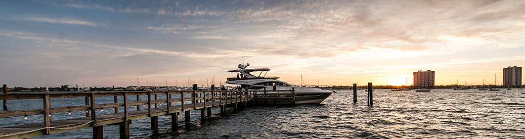 Sea Ray L650 docked facing the sunset.