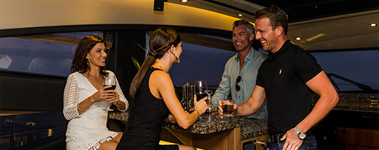 Sea Ray L650 with group of people around counter talking