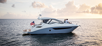 People seated aboard a Sea Ray Sundancer 350 Coupe