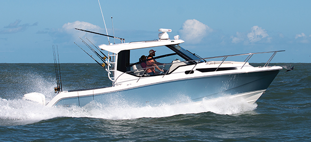 Blue and white boston whaler model in the water