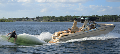 Person wakeboarding behind a boat