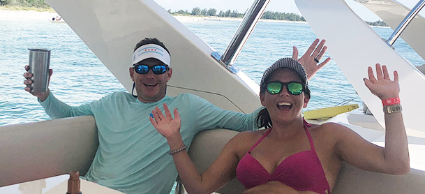 man and woman celebrating with tervis in their hands