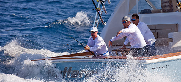 men fishing in large waves