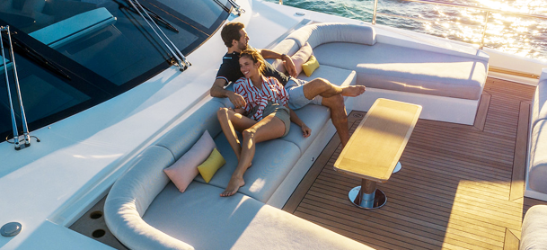 couple sitting at the front of the Azimut yacht