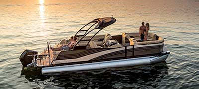 Harris Pontoon in water with sunset in background