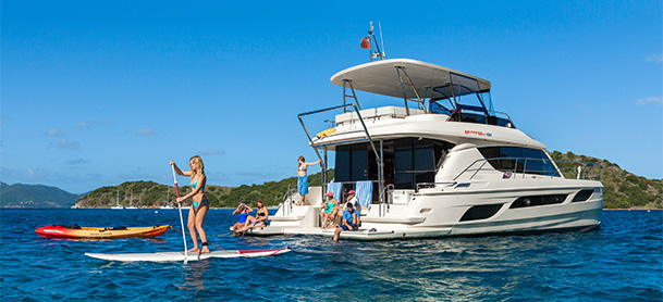 Family on a MarineMax 484 power catamaran charter in the British Virgin Islands