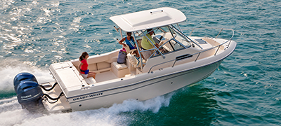 A white Grady-White boat moves across the water