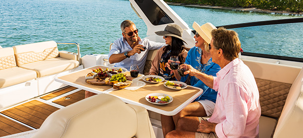 People eating at table on a boat