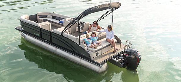 group of woman sitting on the back of a Harris Pontoon