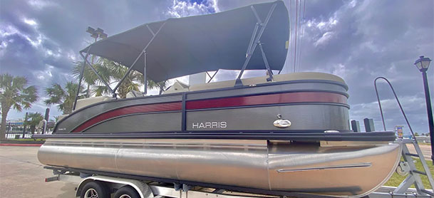 2022 Harris Cruiser 230 with grey and red exterior and black Bimini
