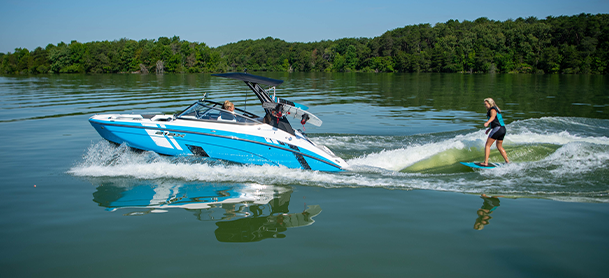 woman skiing behind a jet boats